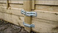 Galvanised steel fence brackets screwed to a timber post, holding lap fence panels on either side